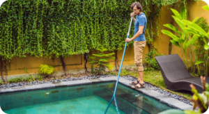Parks Pools technician cleaning a salt cell during saltwater pool service in Orlando