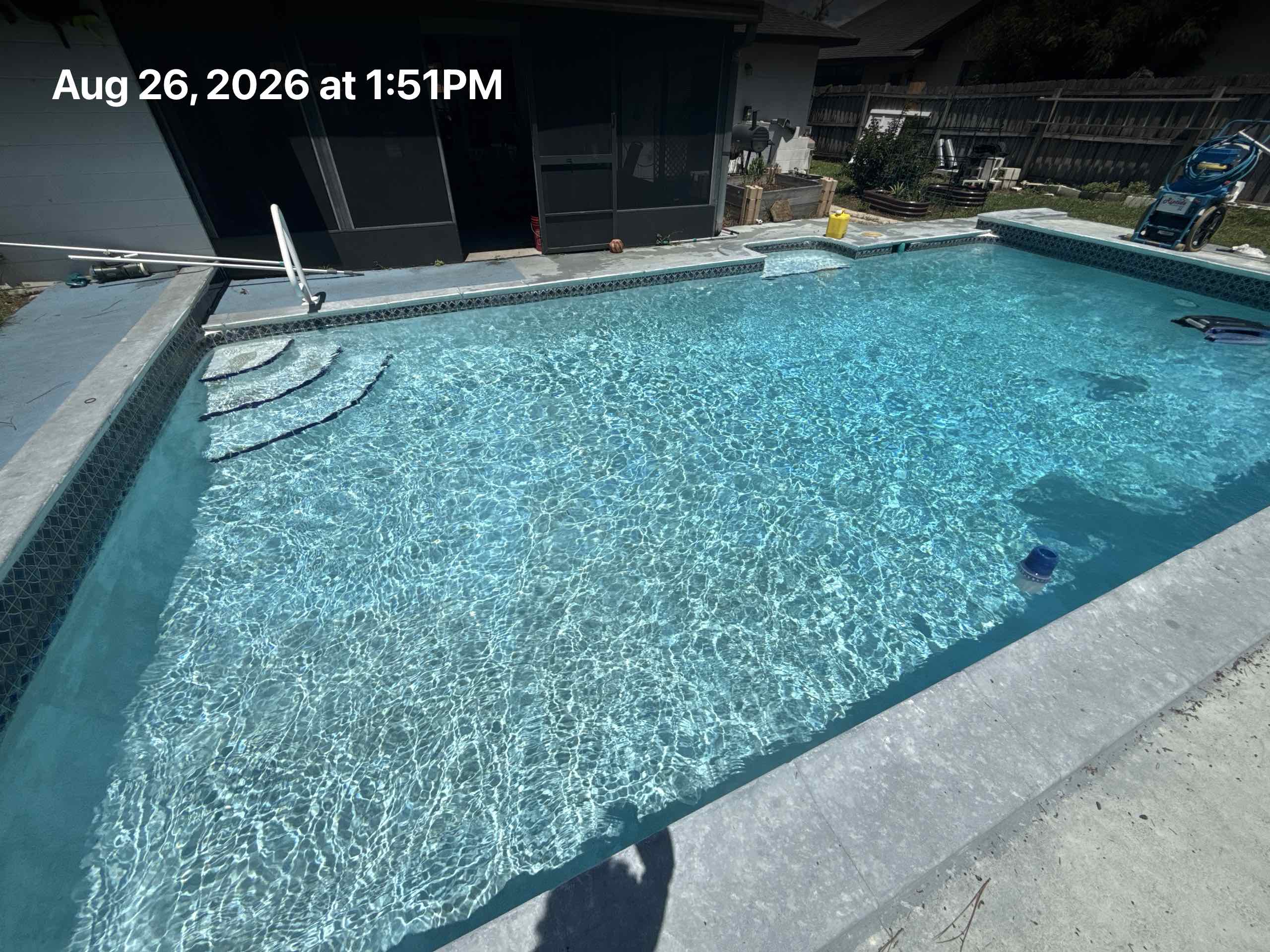 Crystal-clear backyard pool in Maitland, FL serviced by Parks Pools